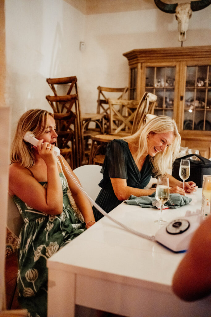 Guests smiling during a wedding reception speech