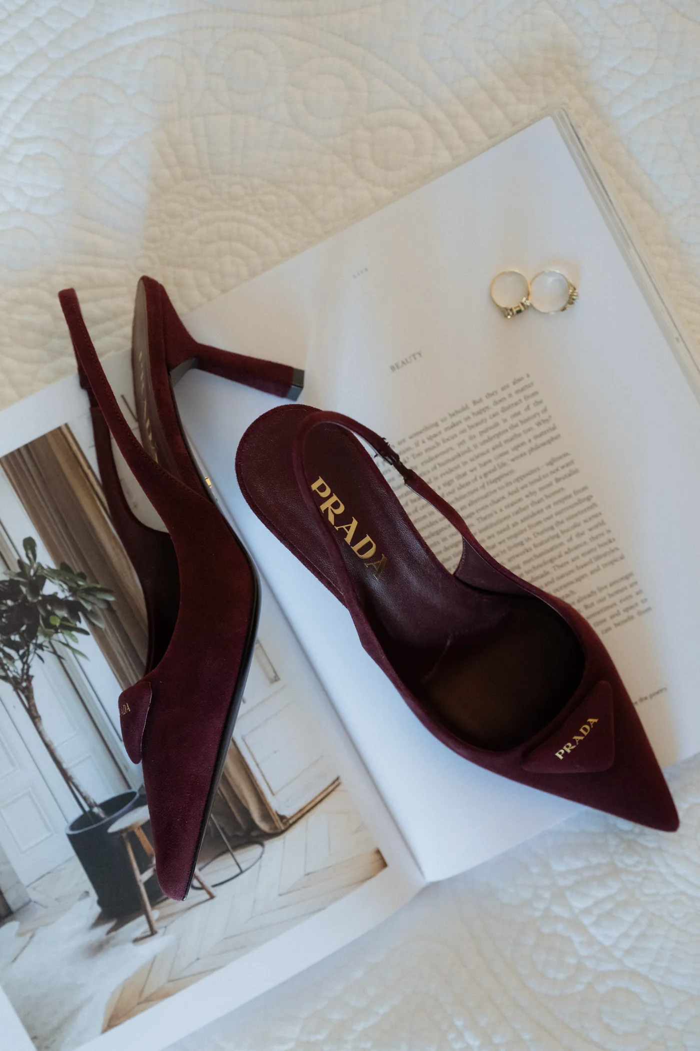 Burgundy bridal shoes and wedding stationery