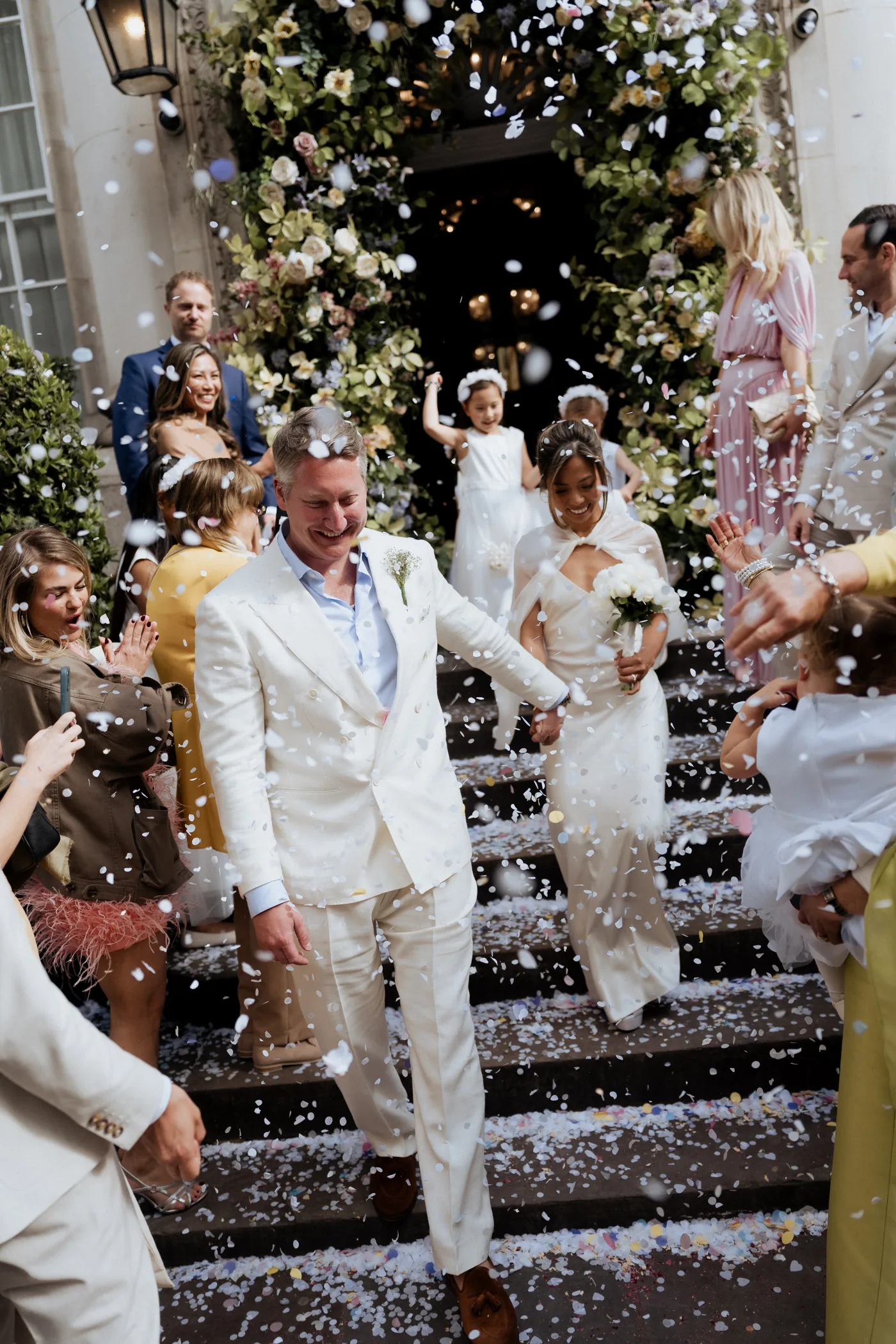 Newlyweds showered with confetti outside their ceremony