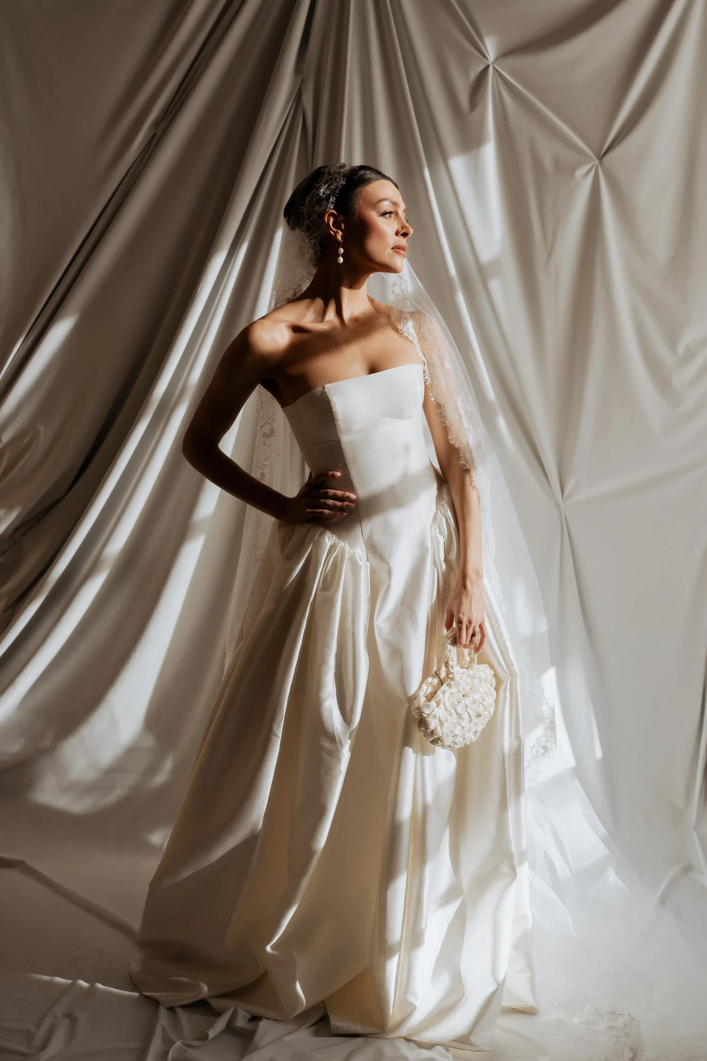 Bridal portrait against softly draped fabric