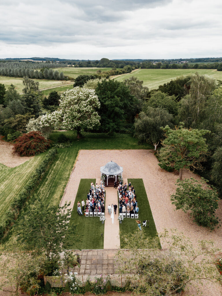 Hodsock Priory outdoor wedding ceremony pergola drone photo