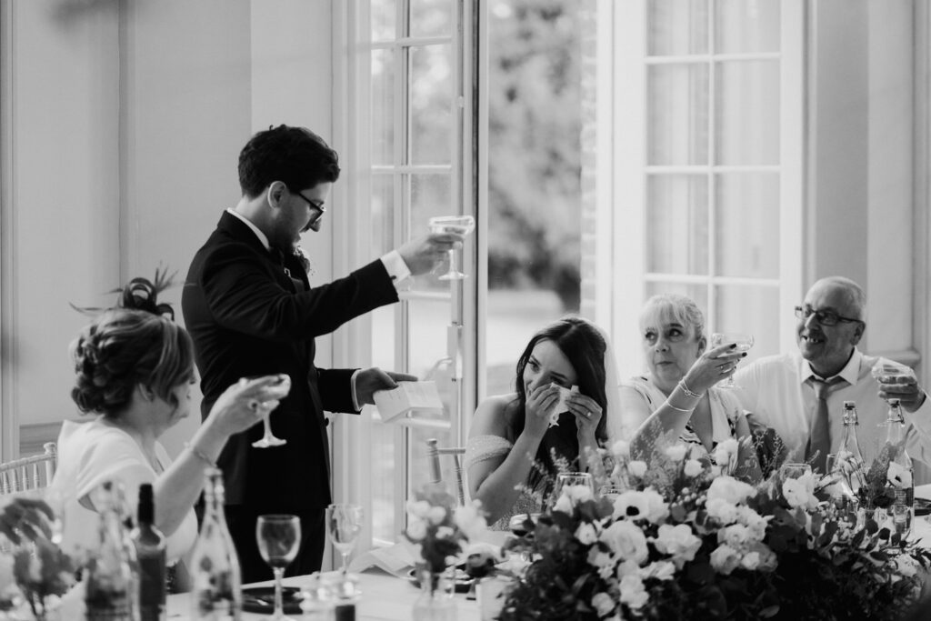 Bride crying at grooms wedding speech at Hodsock Priory