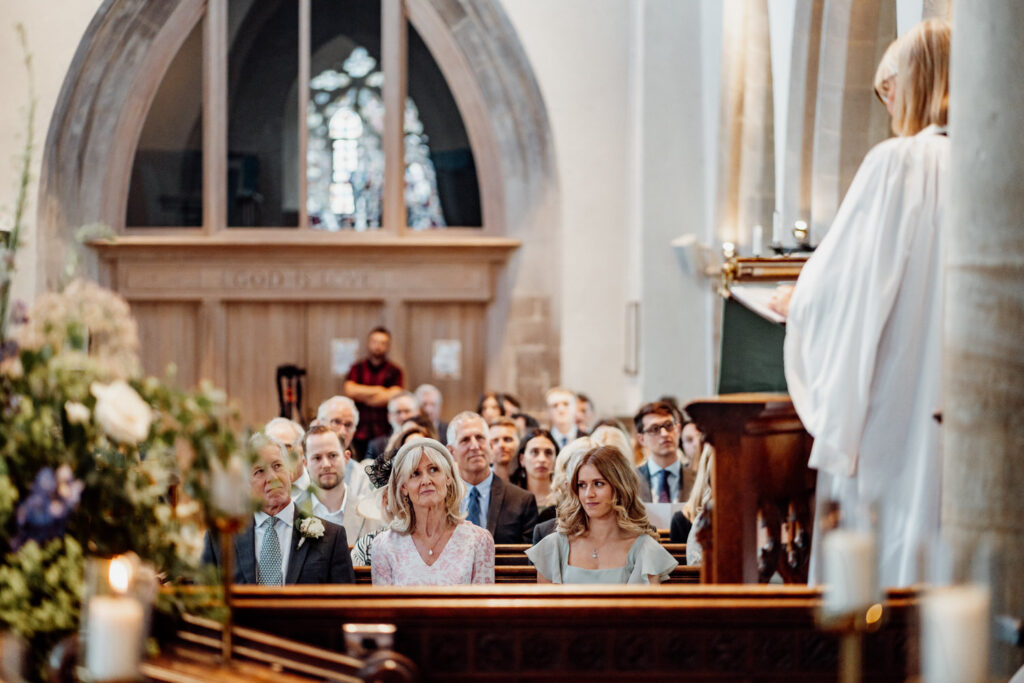 wedding guests sat in church