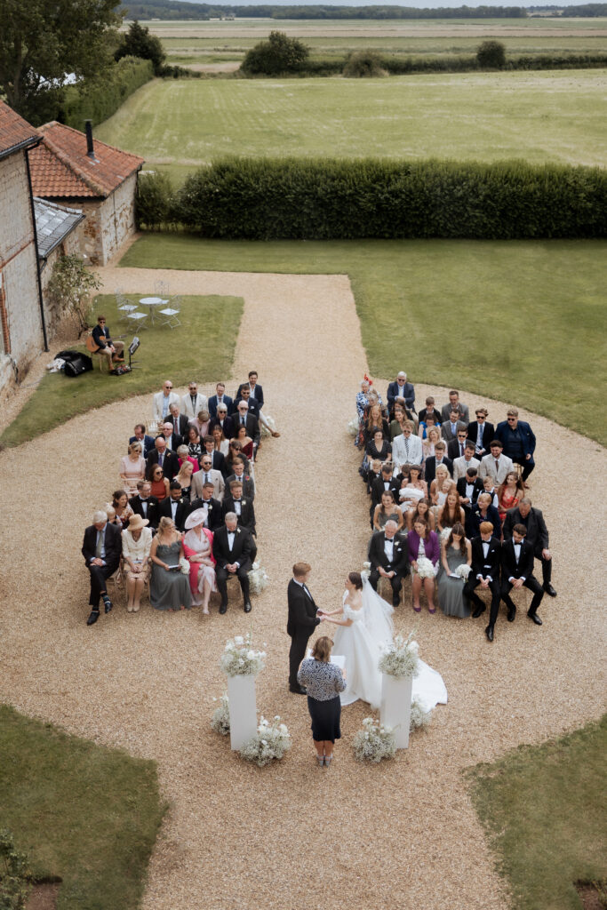 Wedding ceremony at Pentney Abbey taken from above by second photographer